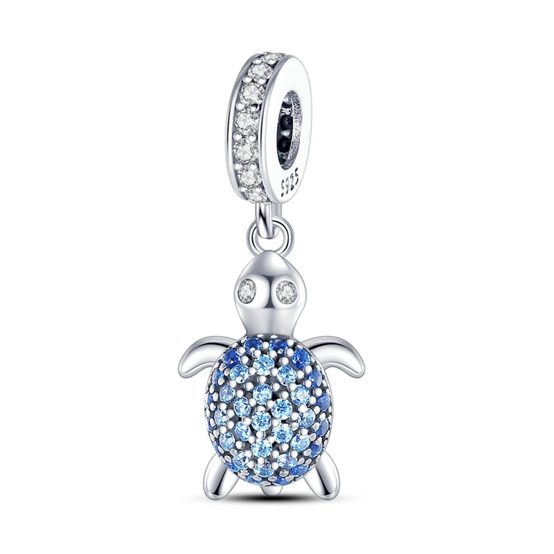 Sterling silver charm pendant set featuring starfish, sea turtle, and whale shark figures