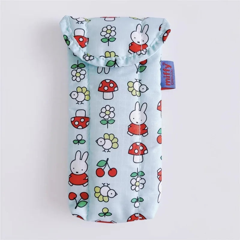 A light blue magnetic storage bag featuring a pattern of Miffy rabbits and mushrooms.