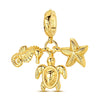 Gold-toned charm pendant set featuring a starfish, sea turtle, and whale shark.
