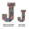 Floral letter J iron-on patch embroidery featuring pink, purple, and blue flowers