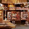 DIY Miniature House kit featuring a wooden bookstore display with LED lighting and various miniature books