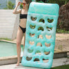 A woman is standing next to a light blue inflatable pool float with a headrest in an outdoor setting.