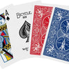 Un assortiment de trois cartes à jouer représentant un cœur, un vélo et divers motifs décoratifs.