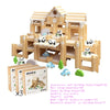 A wooden log cabin building kit featuring a multi-story structure with various accessories like animals and plants.