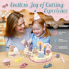 A wooden pretend play birthday cake set with candles and decorations is shown on a table.