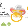 A set of silicone pacifiers and a yellow silicone teat with a yellow cat face, shown next to branding and certification icons