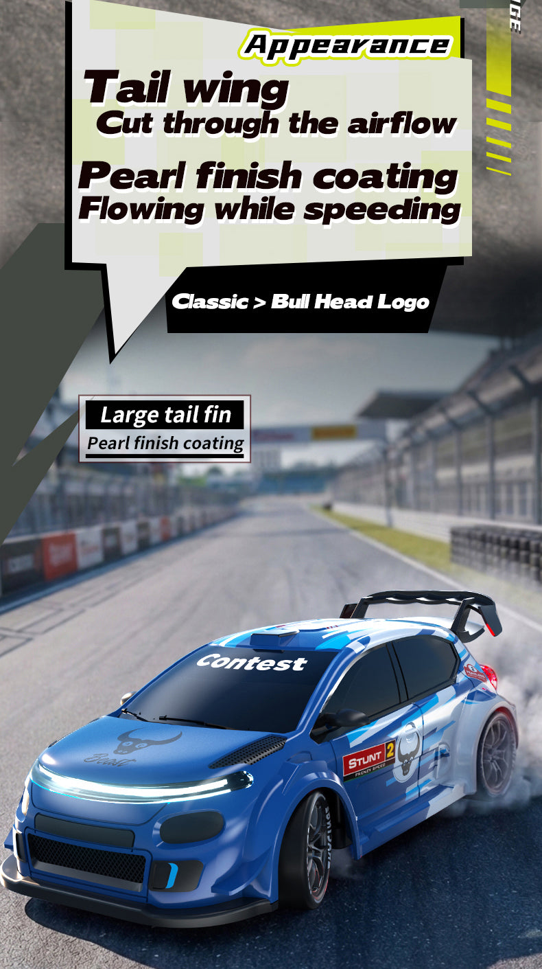 Blue RC drift car with a tail wing and pearl finish coating driving on an asphalt track.