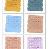 A set of 20 leather-style handmade with love tags in various colors including tan, gray, blue, and pink.