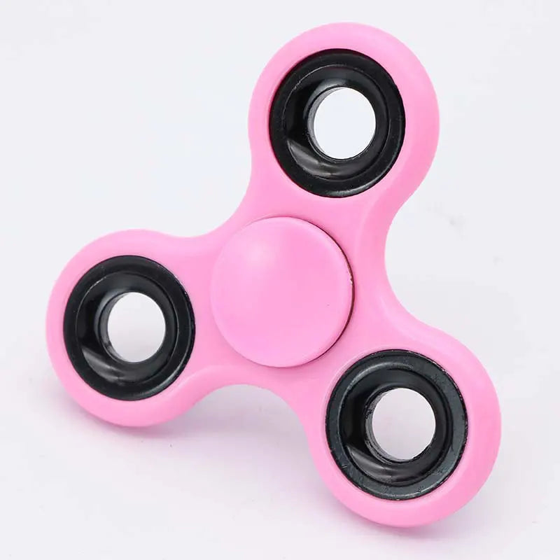 A pink ABS tri-spinner fidget toy with three black spinners.