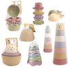 A set of boat-shaped stacking cups and bath toys for toddlers in various pastel colors.