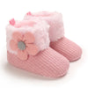 Pink plush baby snow boots for girls and boys with a soft faux fur trim