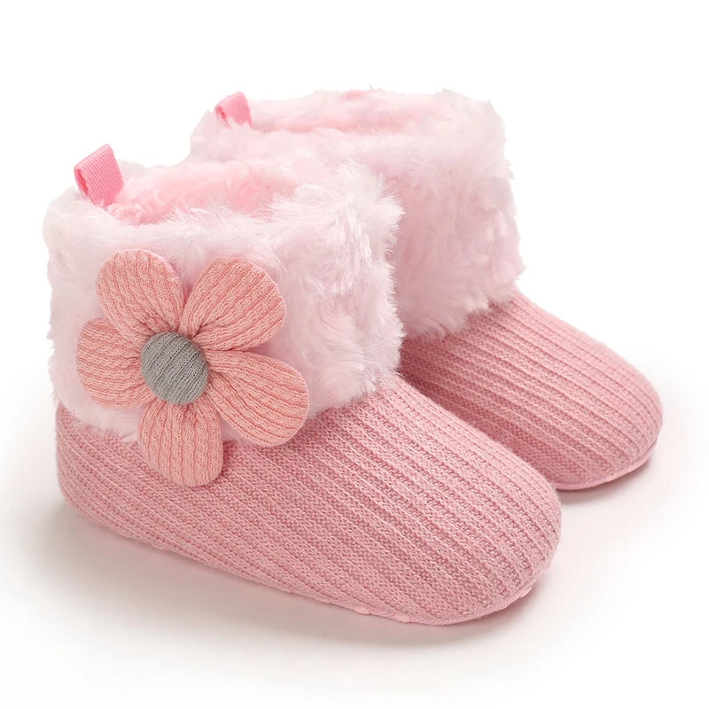 Pink plush baby snow boots for girls and boys with a soft faux fur trim