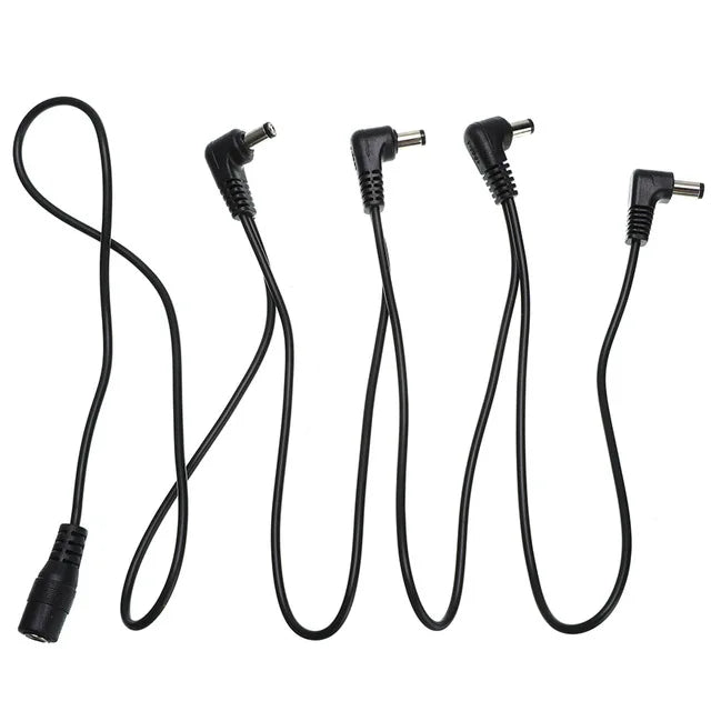 A set of guitar pedal power daisy chain cables with various connectors.