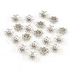 A collection of silver Tibetan style hollow flower bead caps for jewelry making
