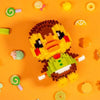 A yellow and brown Lego-style animal figure built from building blocks on an orange background.