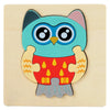 A wooden puzzle depicting a blue and gray owl with yellow accents.