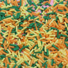 A close-up view of multicolored soft polymer clay candy sprinkles in various shapes and colors for cake decorating.