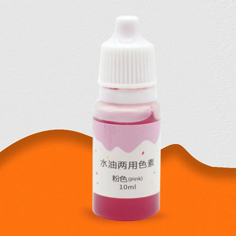 A small glass bottle of pink liquid soap colorant with a white dropper cap and label