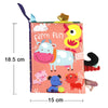 A colorful cloth book featuring various farm animals like a cow, pig, and cat for baby sensory development.