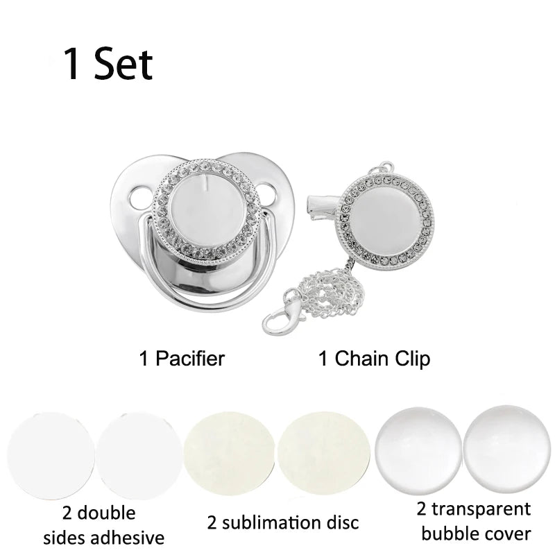 A set of baby pacifiers and a chain clip with rhinestone accents, including adhesive discs and bubble covers.