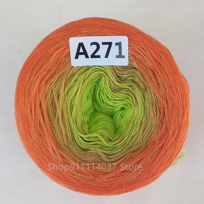 A spool of orange yarn labeled A271 with a green core visible.