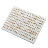 A collection of assorted acrylic stud earrings featuring hearts, stars, and moons in gold-toned metal.