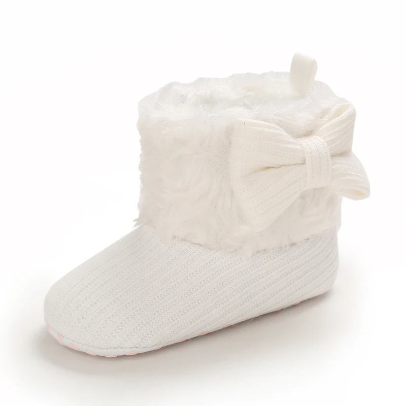 White plush baby snow boots for girls and boys with a fluffy bow detail