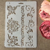 A white stencil featuring intricate flower vine patterns for crafting and wall art