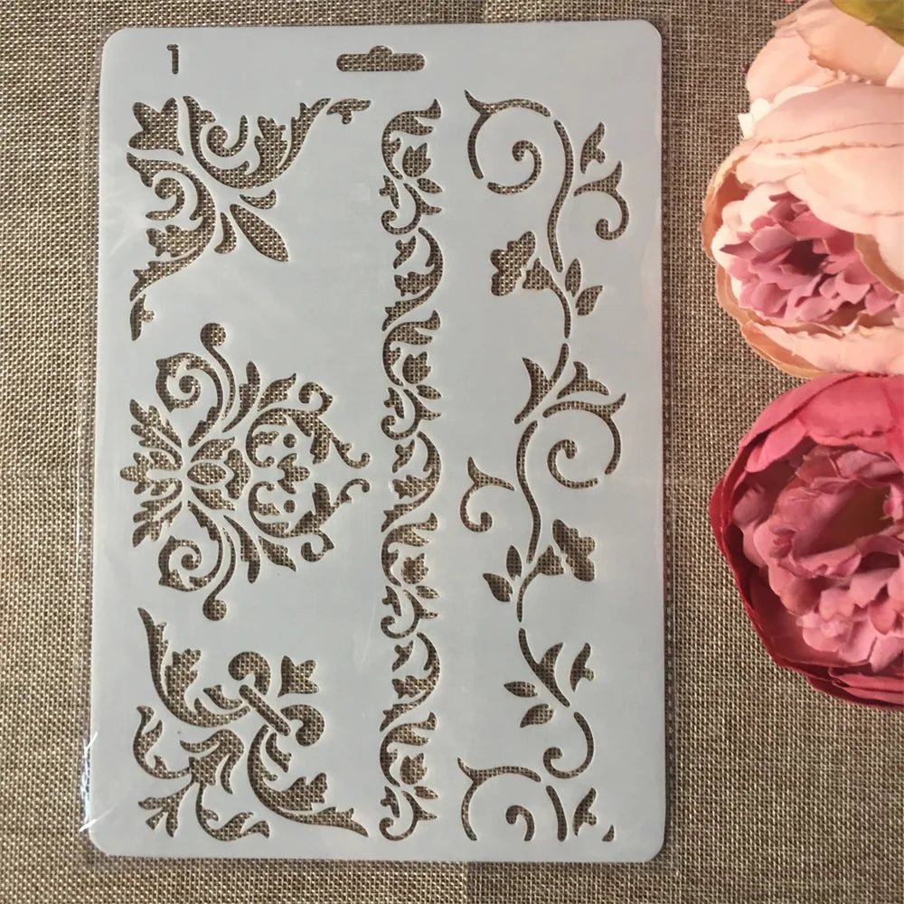 A white stencil featuring intricate flower vine patterns for crafting and wall art