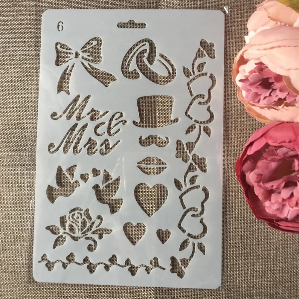 A clear silicone stencil sheet with various floral and decorative elements like bows, roses, hearts, and vines for crafting.