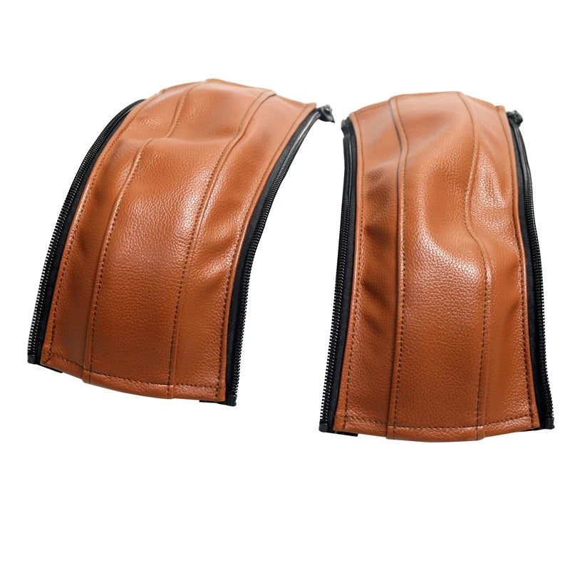 Brown leather stroller handle cover with black zipper for a protective grip.