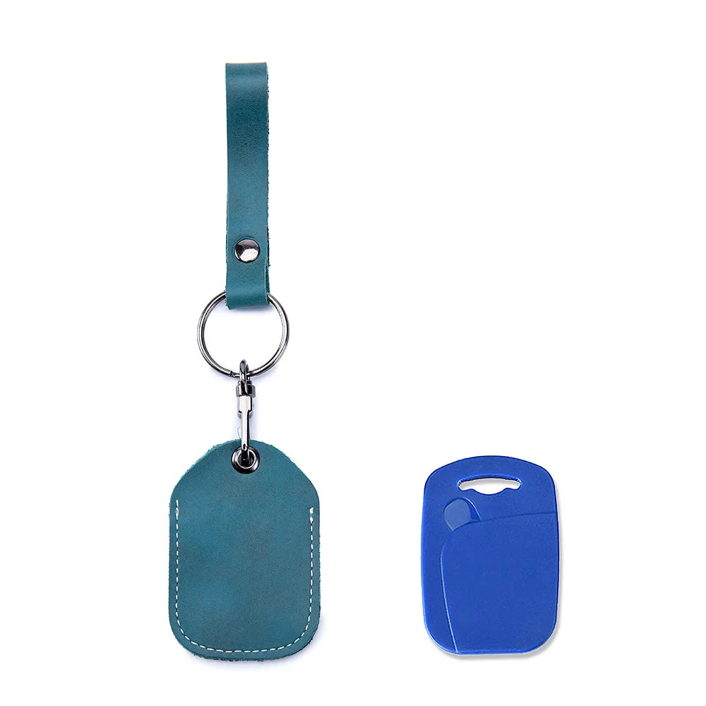 A teal leather key wallet with a strap and a blue silicone card holder.