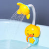 A yellow duck bath toy set with a sliding track pouring water into a bathtub.