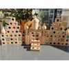 A collection of wooden building blocks and acrylic gemstones arranged in a tiered structure.