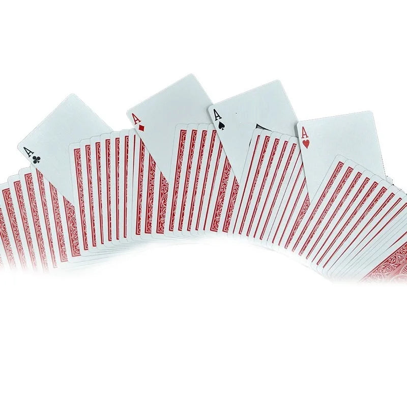 A close-up deck of playing cards with red markings and white cards fanned out.