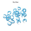 A collection of sky blue metal open jump rings for DIY jewelry making