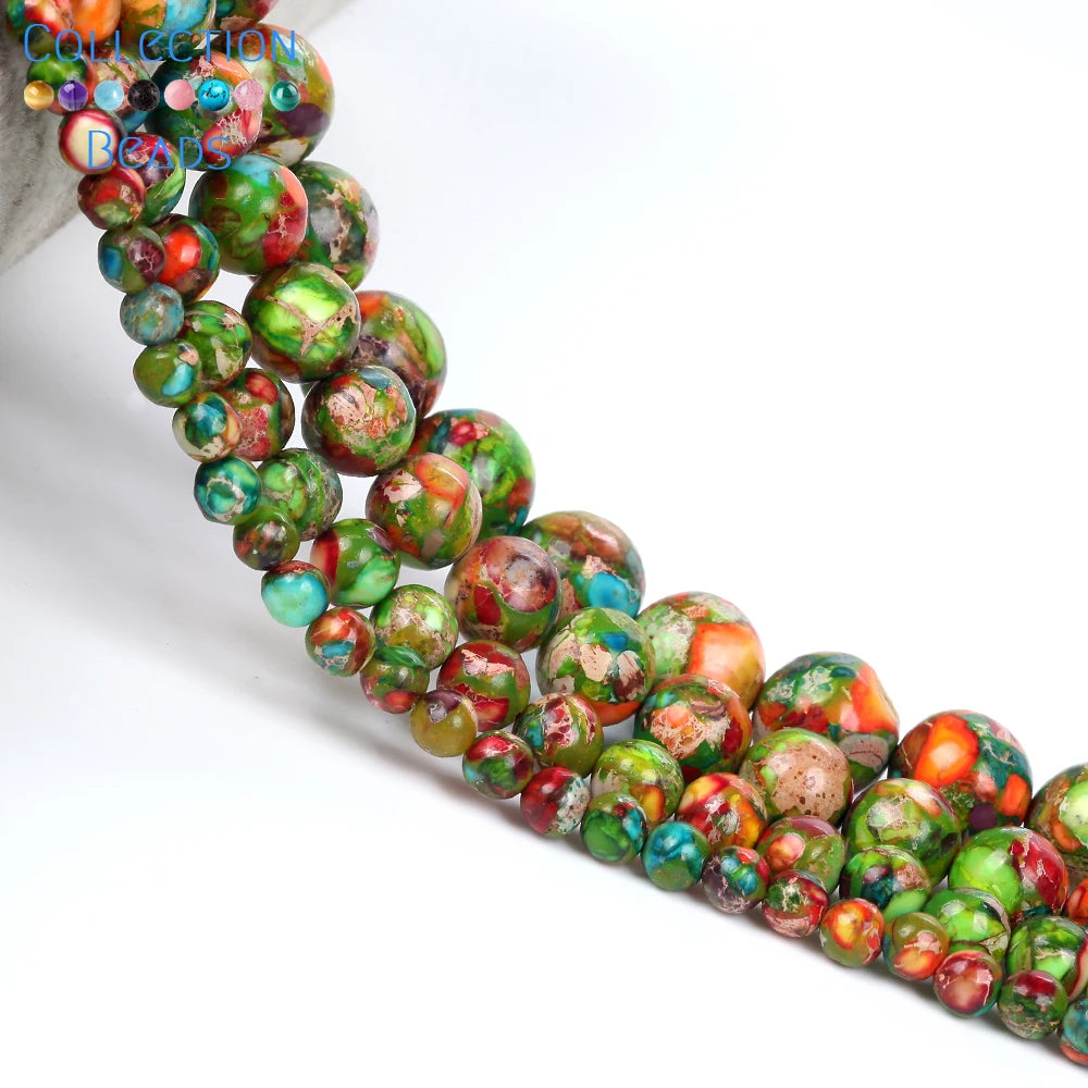 A strand of natural sea sediment jasper and turquoise beads for jewelry making