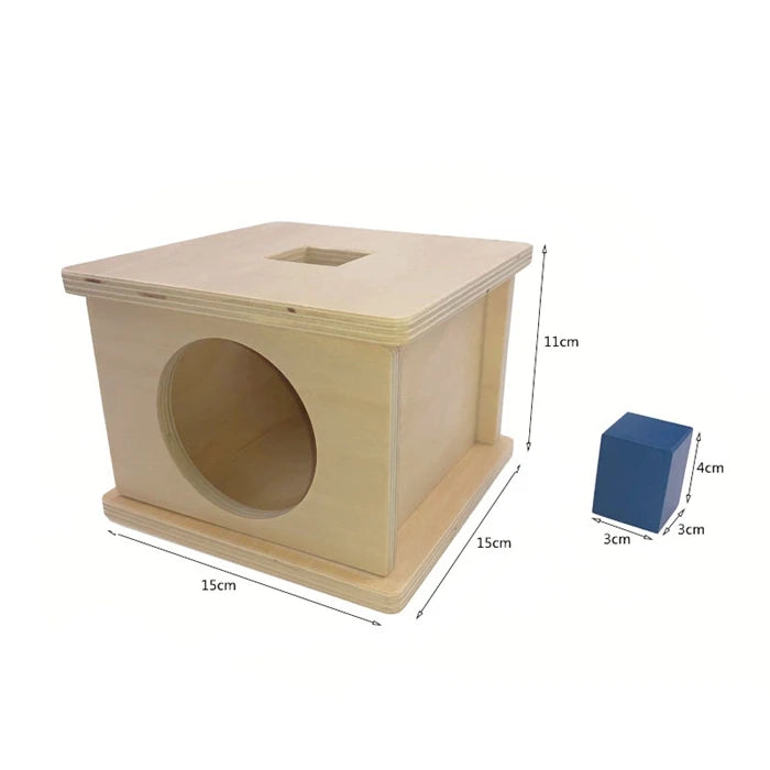 A wooden sensory toy set for toddlers featuring a box with an oval opening and a wooden block.