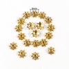 A circular arrangement of small gold-colored hollow flower bead caps for jewelry making, with a scale indicating 8mm.