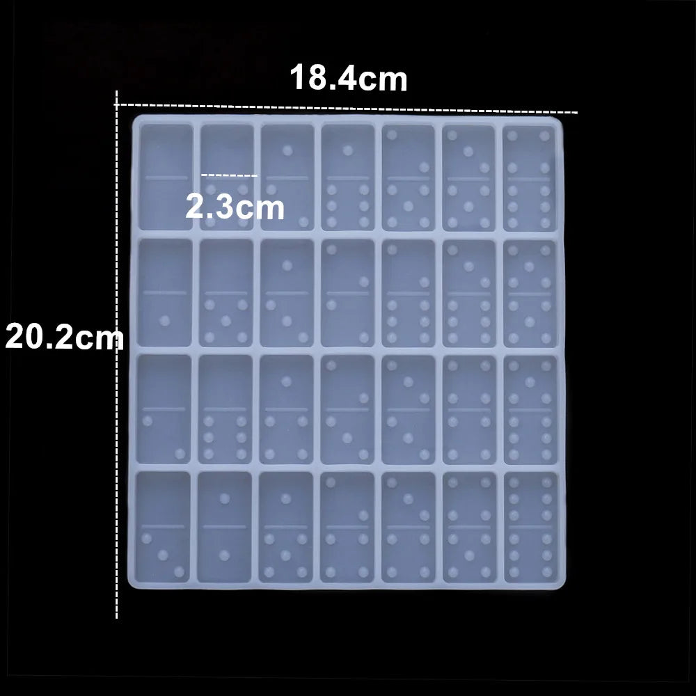 A silicone mold set with 18.4cm by 20.2cm dimensions, featuring multiple small, square cavities for jewelry making.
