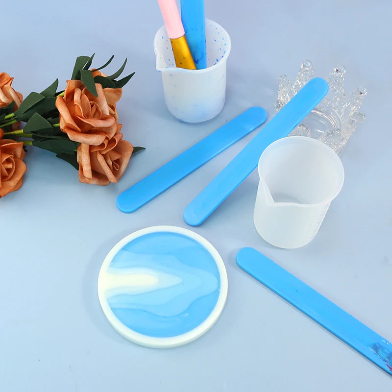 A set of blue silicone stir sticks and mixing tools for resin, epoxy, and paint.
