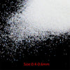 A pile of fine, white and iridescent glass bubble beads with a size range of 0.4 to 0.6 mm.