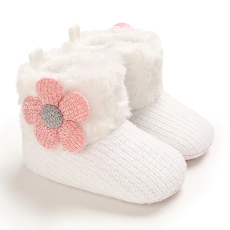 White plush baby snow boots for girls and boys with pink floral accents