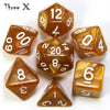 A collection of amber-colored polyhedral dice, including dodecahedrons and tetrahedrons, scattered on a white surface.