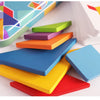 Colorful wooden animal tangram puzzle pieces arranged on a white surface.