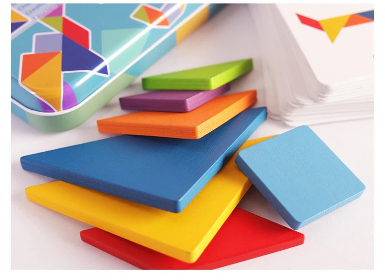 Colorful wooden animal tangram puzzle pieces arranged on a white surface.