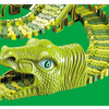 A plastic dinosaur toy with a green head and yellow track pieces, showing the vehicle set.
