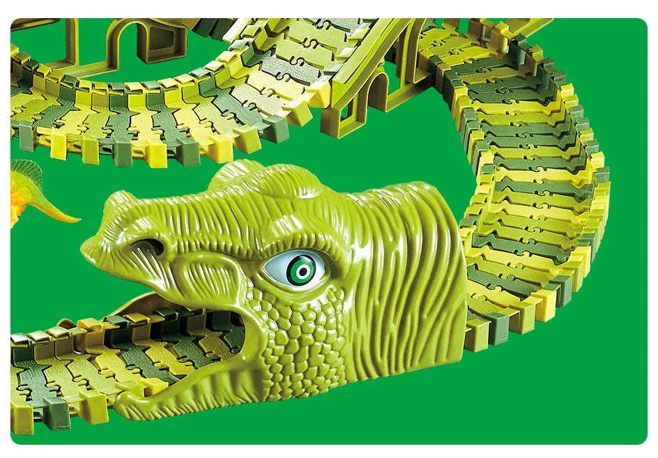 A plastic dinosaur toy with a green head and yellow track pieces, showing the vehicle set.