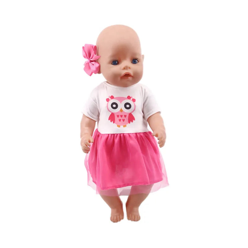 A handmade doll dress for an 18-inch American Girl doll featuring a white top with a pink owl design and a pink tulle skirt.