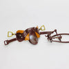 A detailed 1/12 scale dollhouse horse saddle and riding prop accessory made of brown leather and gold accents.